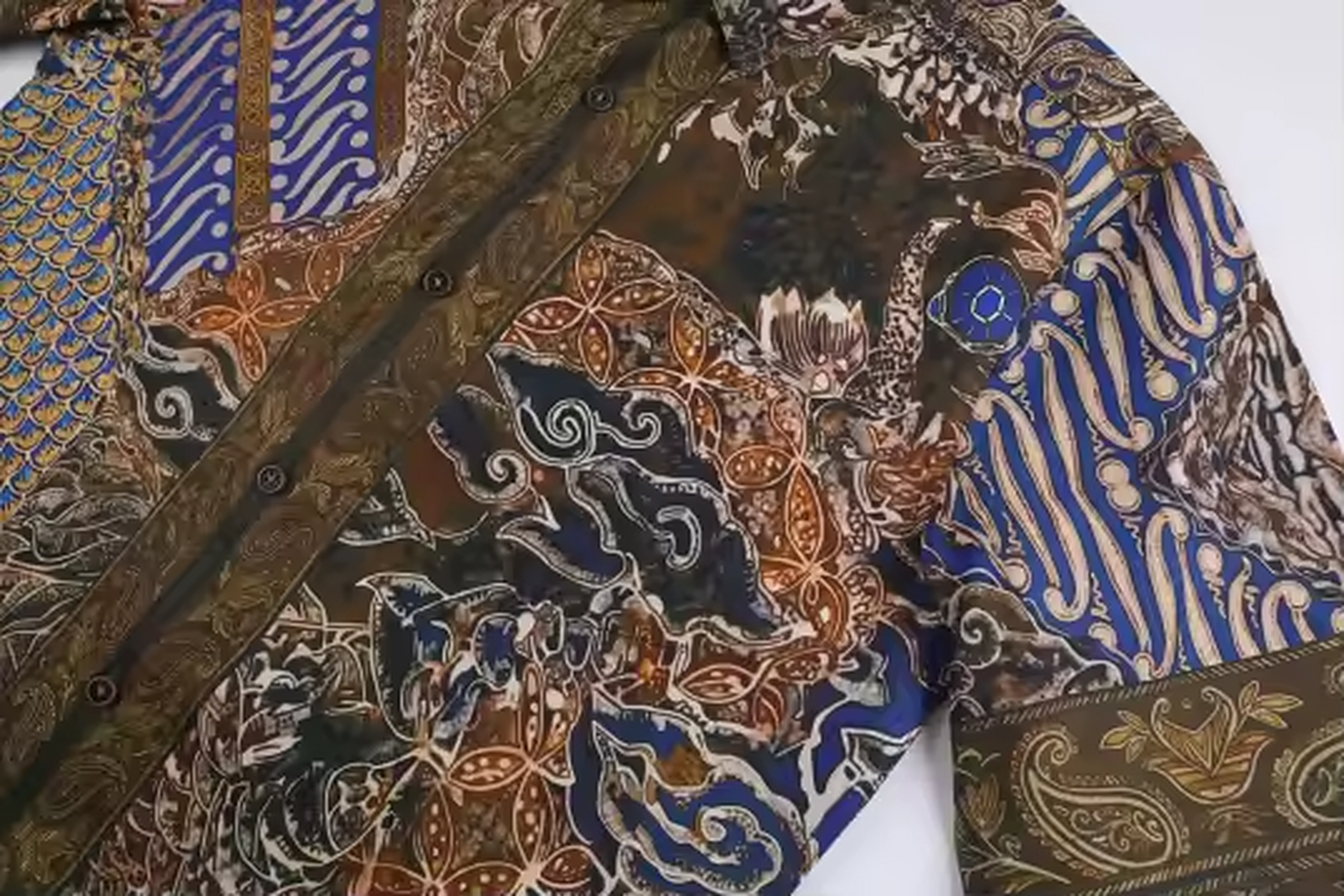 Crest of Jormungandr Resort Shirt | Hand-Drawn World Serpent Mythology Batik Parang Diagonal Waves Megamendung Clouds Kawung Floral Paisley Filigree Scales & Old City Architecture in Royal Blue Indigo Olive Gold | Bold Edgy Rebel Fearless Statement Piece Wearable Art Quiet Luxury Old Money Indie Vanguard Camp Collar Resort Shirt 1 of 1 Human Made Wearable Art 2026 by Kurt Wollton DARO Studio