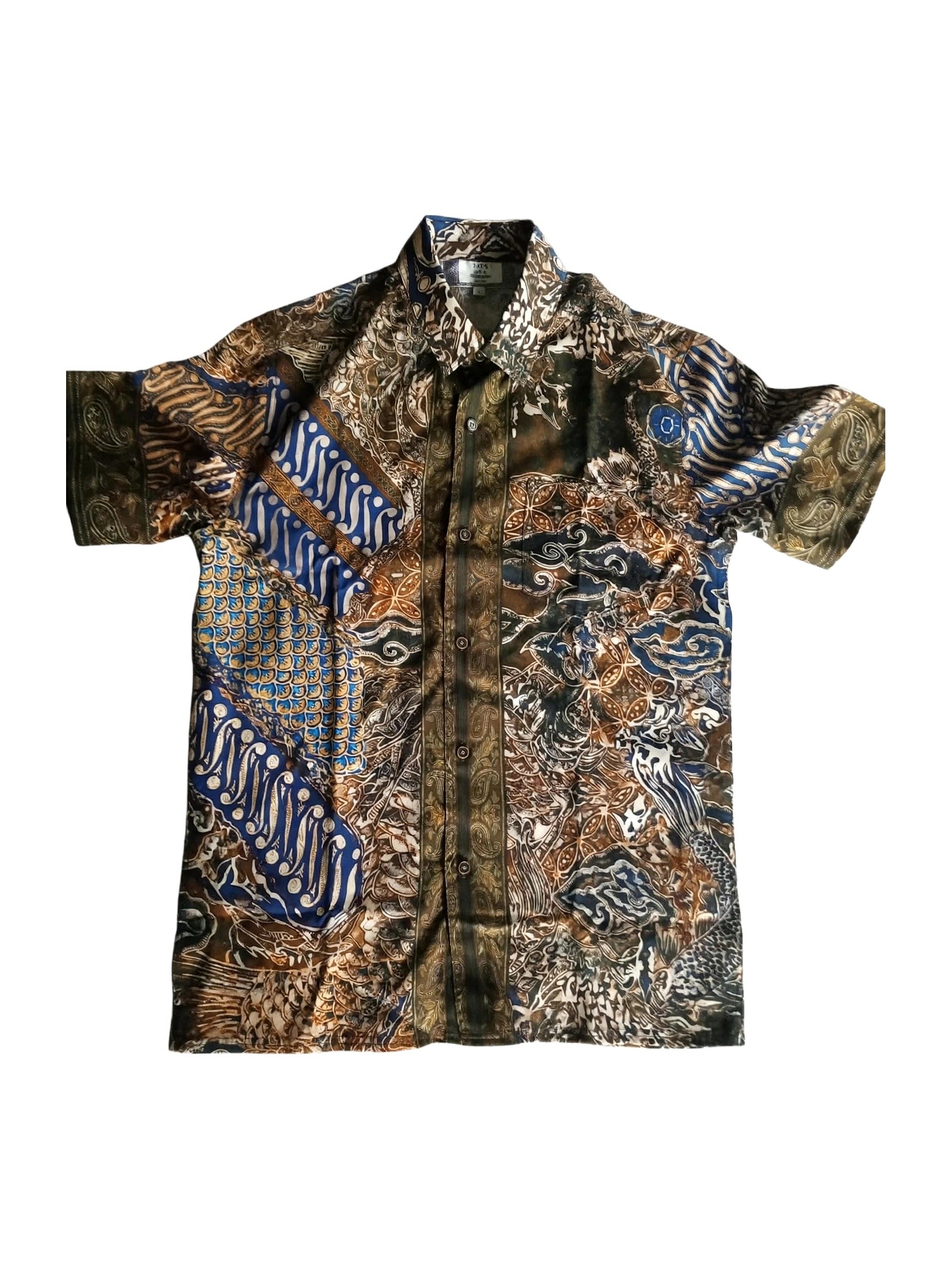 Crest of Jormungandr Resort Shirt | Hand-Drawn World Serpent Mythology Batik Parang Diagonal Waves Megamendung Clouds Kawung Floral Paisley Filigree Scales & Old City Architecture in Royal Blue Indigo Olive Gold | Bold Edgy Rebel Fearless Statement Piece Wearable Art Quiet Luxury Old Money Indie Vanguard Camp Collar Resort Shirt 1 of 1 Human Made Wearable Art 2026 by Kurt Wollton DARO Studio