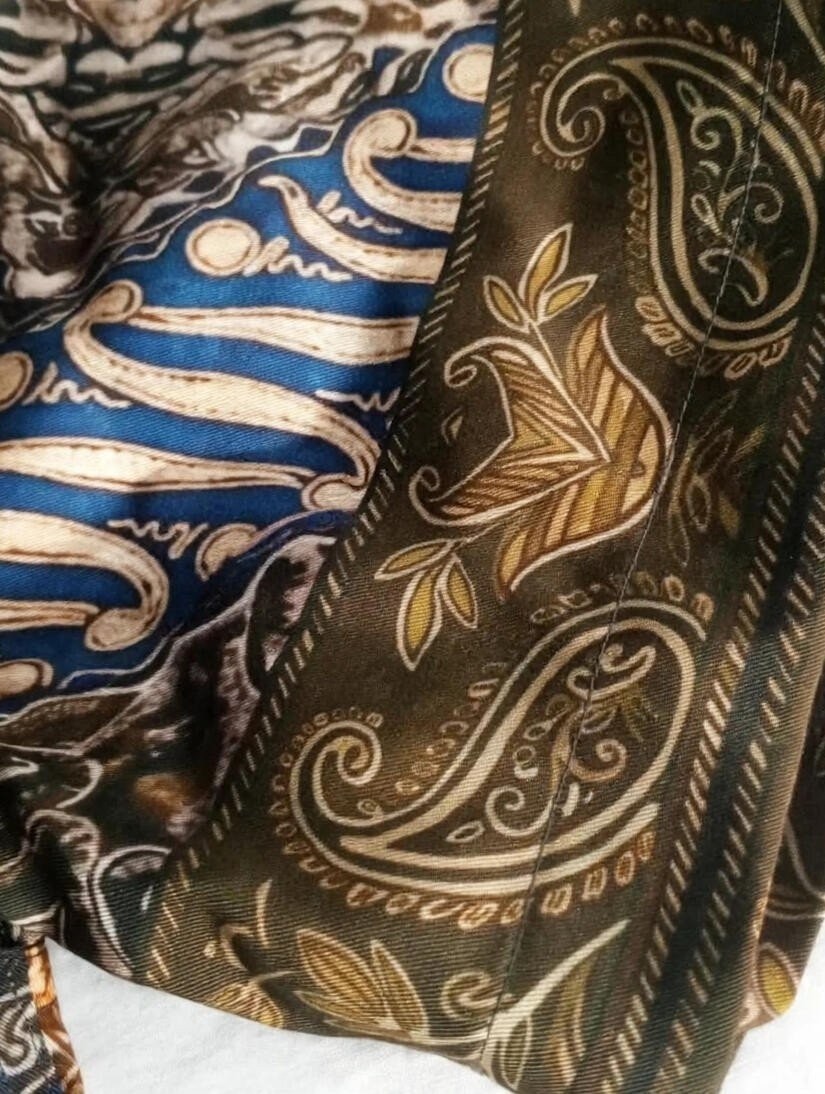 Crest of Jormungandr Resort Shirt | Hand-Drawn World Serpent Mythology Batik Parang Diagonal Waves Megamendung Clouds Kawung Floral Paisley Filigree Scales & Old City Architecture in Royal Blue Indigo Olive Gold | Bold Edgy Rebel Fearless Statement Piece Wearable Art Quiet Luxury Old Money Indie Vanguard Camp Collar Resort Shirt 1 of 1 Human Made Wearable Art 2026 by Kurt Wollton DARO Studio